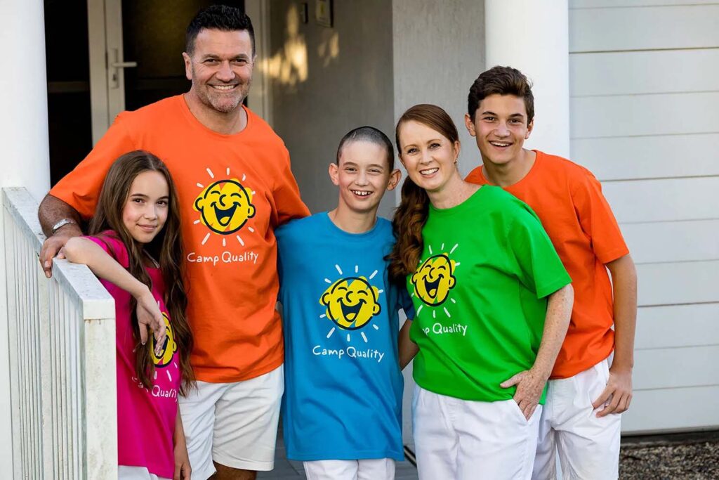 Camp Quality family group photo at an NRMA Resort